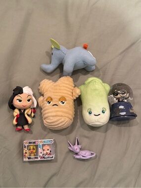 Collection of figurines and plushies from Mystery Boxes